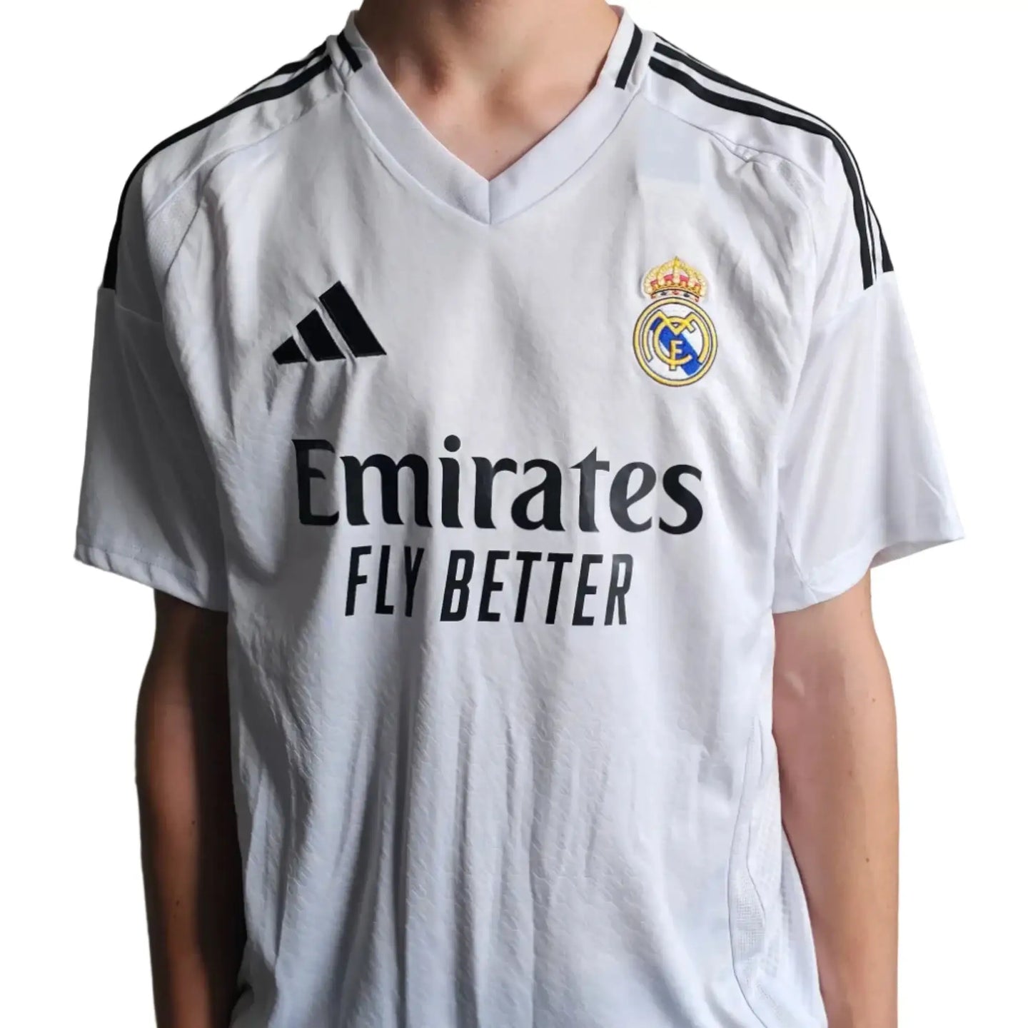 Back view showing Real Madrid crest, Emirates sponsor, and Adidas logo on a white football shirt.