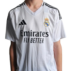 Back view showing Real Madrid crest, Emirates sponsor, and Adidas logo on a white football shirt.