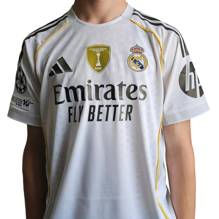 Back view featuring Real Madrid crest, adidas logo, and Emirates Fly Better sponsor text.