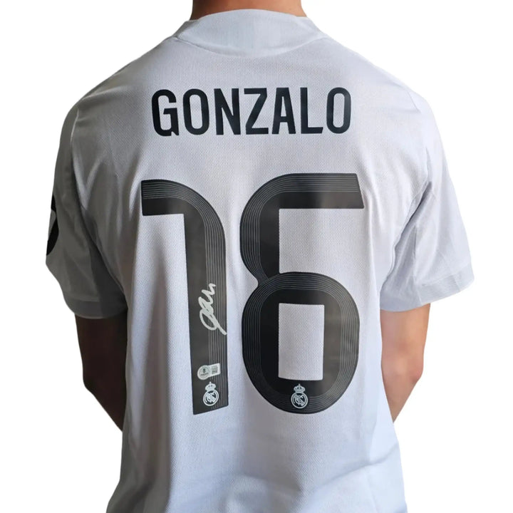 Back view showing Gonzalo and No. 16 along with a signature.