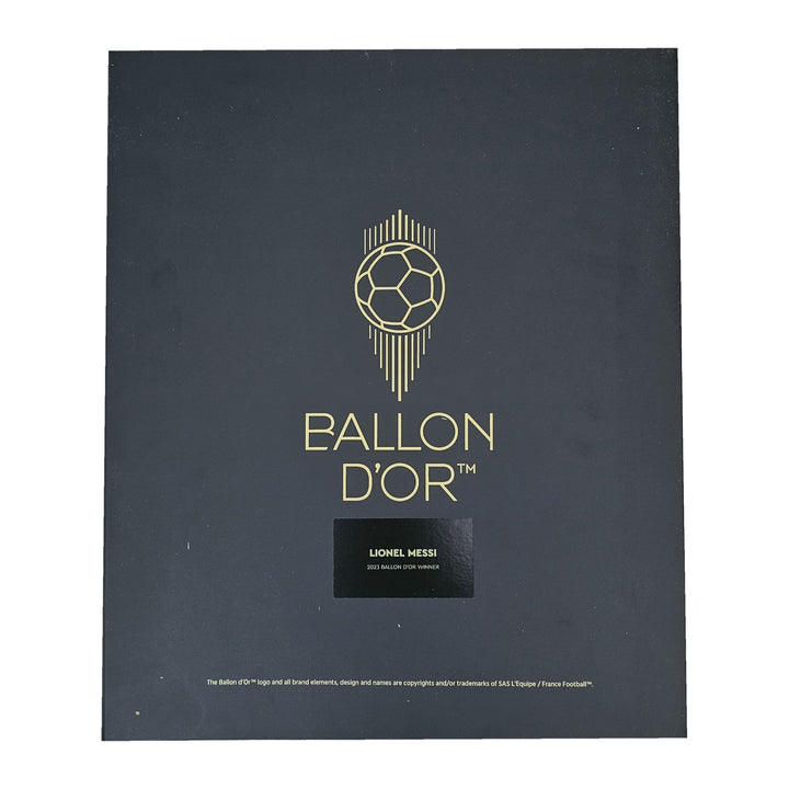 Ballon d'Or presentation box lid, gold ball logo above a Lionel Messi plaque, from his signed Barcelona 2020-21 shirt.