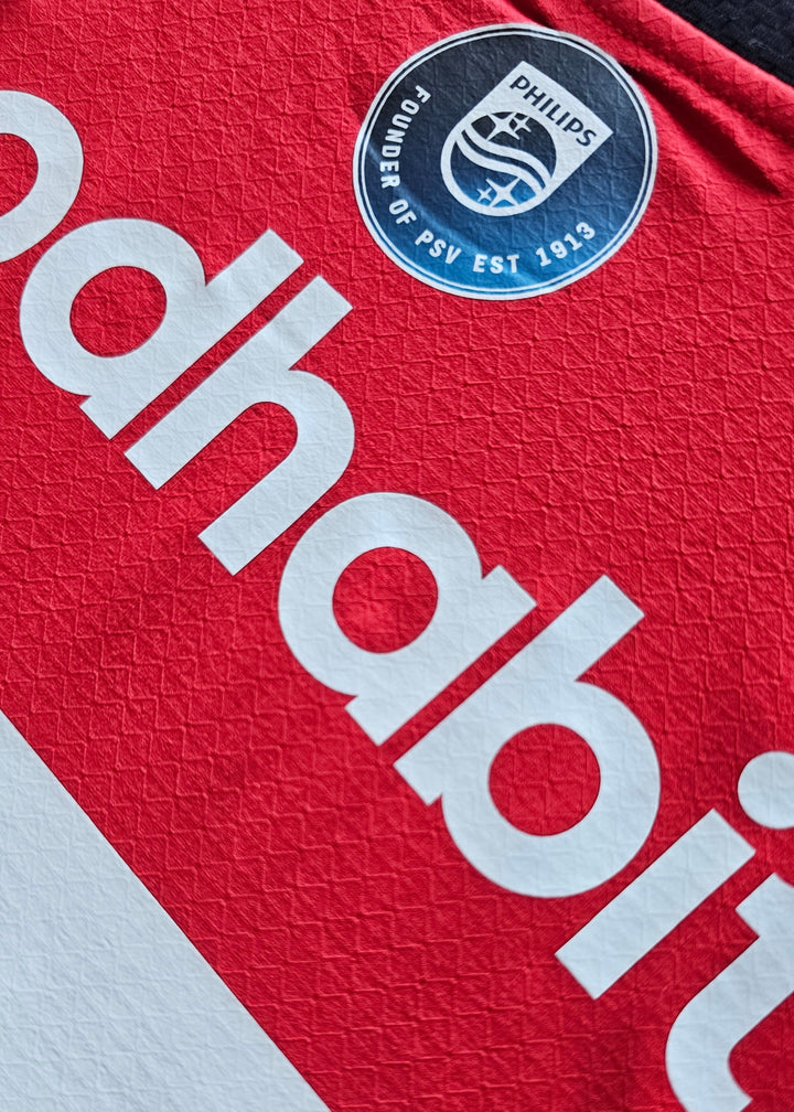 Philips Founder of PSV Est 1913 badge above the goodhabitz lettering on the back of the Amir Bouhamdi PSV 2026-27 shirt