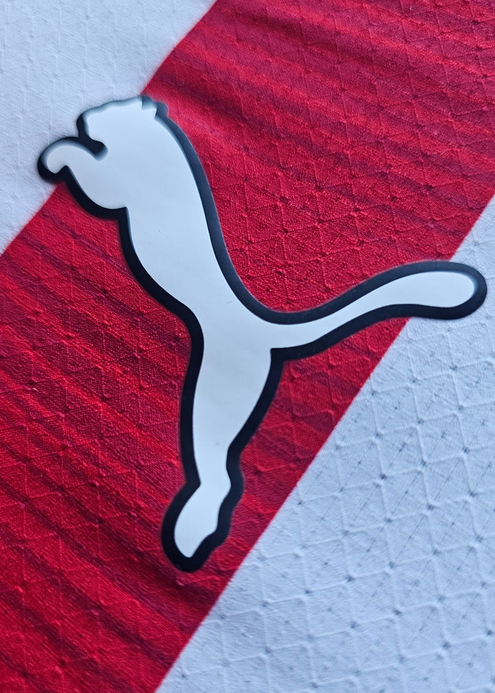 White Puma logo across the red and white stripes of the Amir Bouhamdi PSV 2026-27 home shirt, number 37