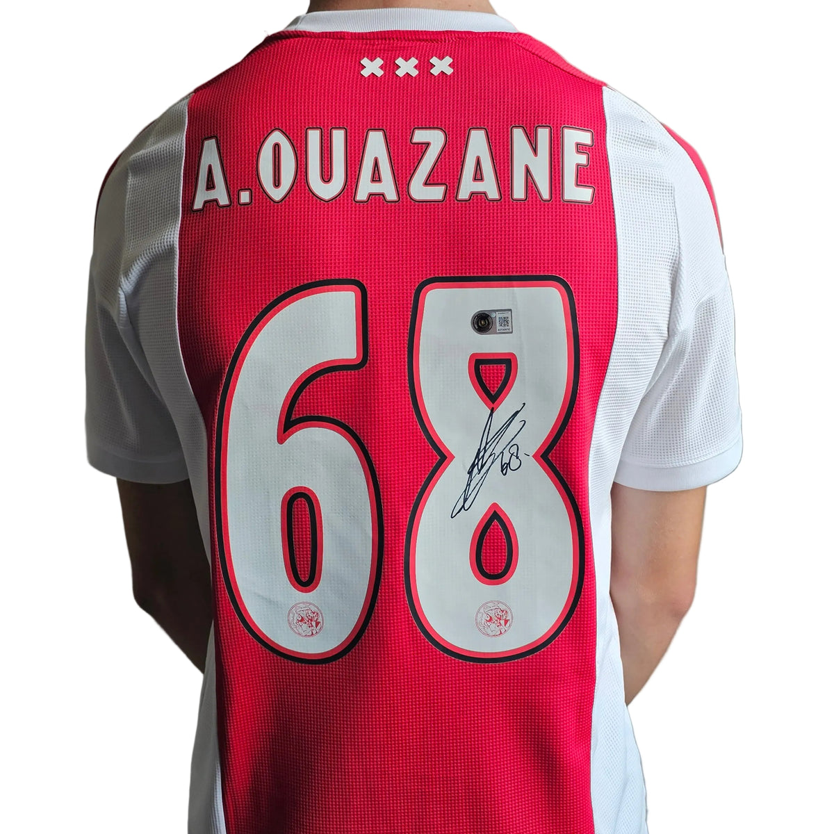 Back of Abdellah Ouazane's signed Ajax 2026-27 home shirt, A.OUAZANE 68 with his signature on the 8