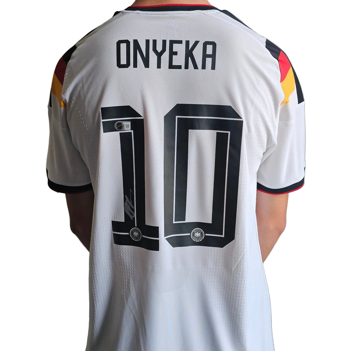Back of Francis Onyeka's signed white Germany 2025-26 home shirt, black ONYEKA 10, signature on the 1
