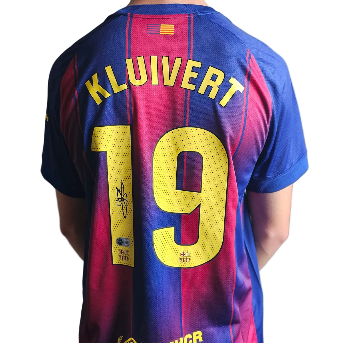 Shane Kluivert's signature on the yellow 1 of KLUIVERT 19, back of his signed FC Barcelona 2025-26 home shirt