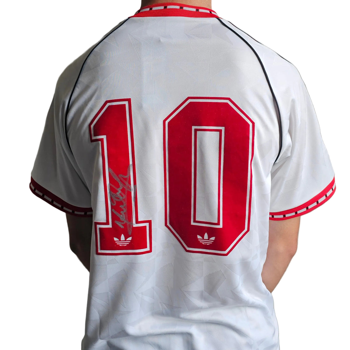 Back of Mark Hughes's signed white Manchester United 1990-91 away design reissue, signature on the red 1 of the 10