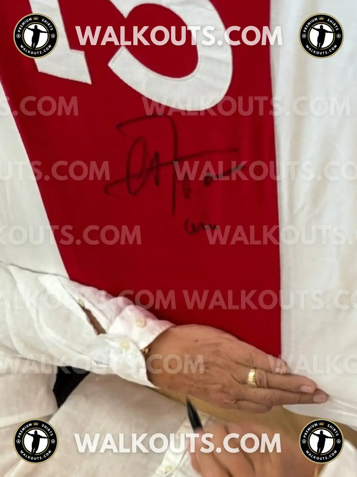 Red Ajax jersey numbered No. 15 with Arie Haan's signature visible on the front.