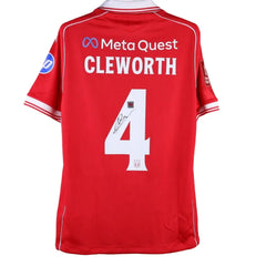 Back view showing No. 4, Cleworth name, and signature on a red football shirt with sponsor logo.