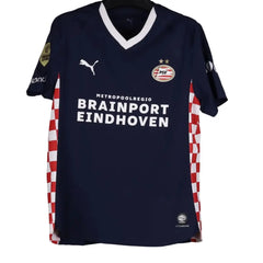 Navy sports jersey with visible branding on a gray background