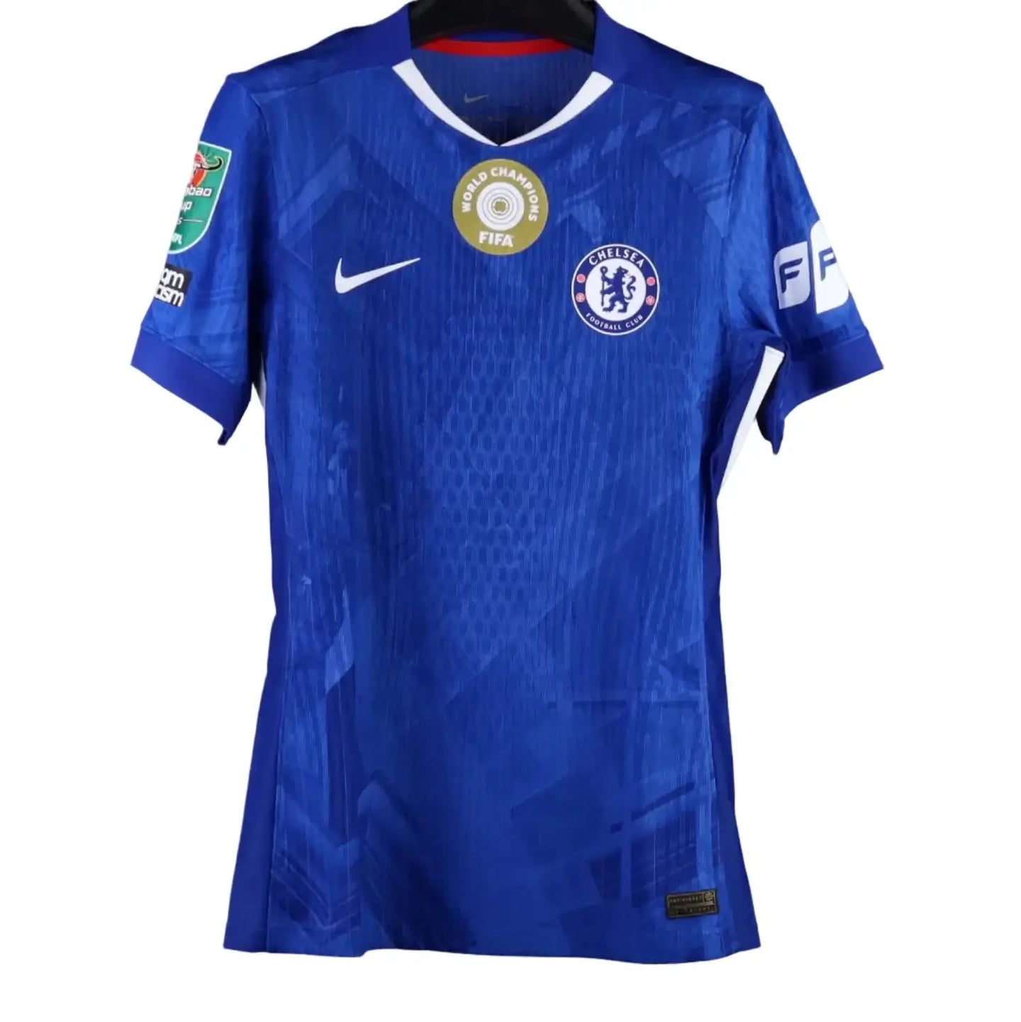 Back view showing blue Chelsea F.C. football shirt with FIFA World Champions badge.