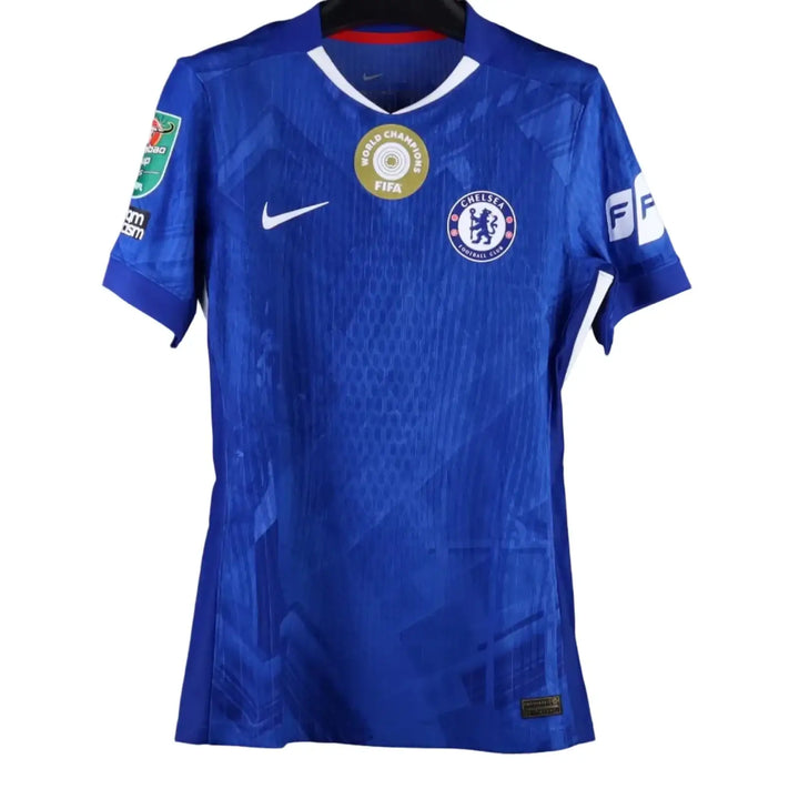 Back view showing blue Chelsea F.C. football shirt with FIFA World Champions badge.