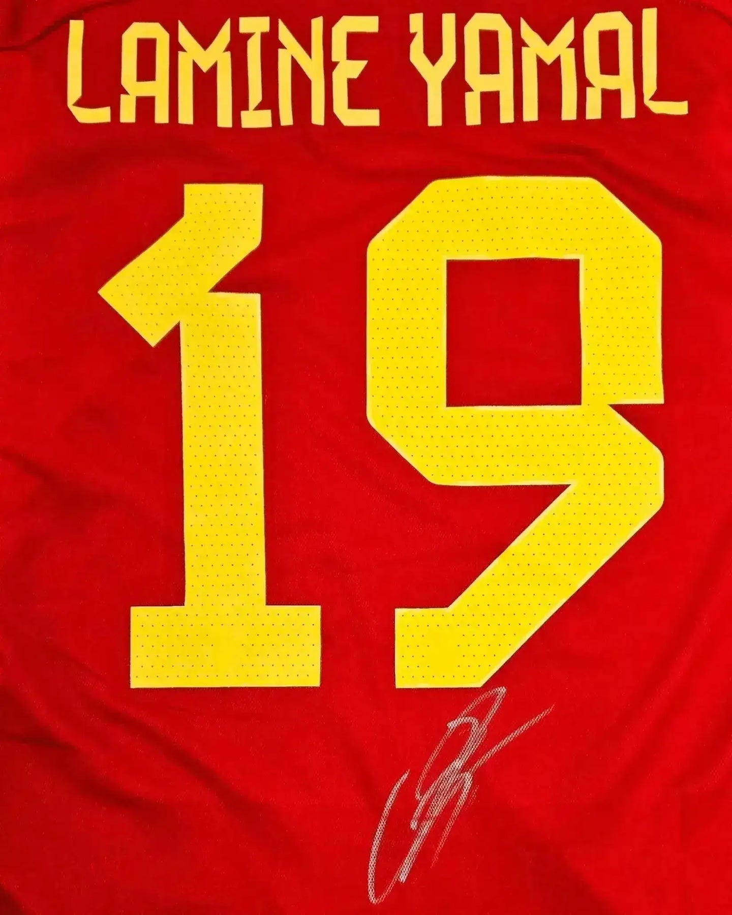 Back view featuring the name Lamine Yamal, No. 19 in yellow, and a visible signature.