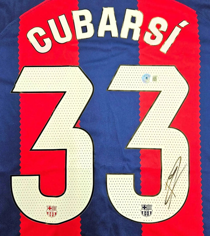 Back view showing Cubarsí, No. 33, and signature on a red and blue football shirt.