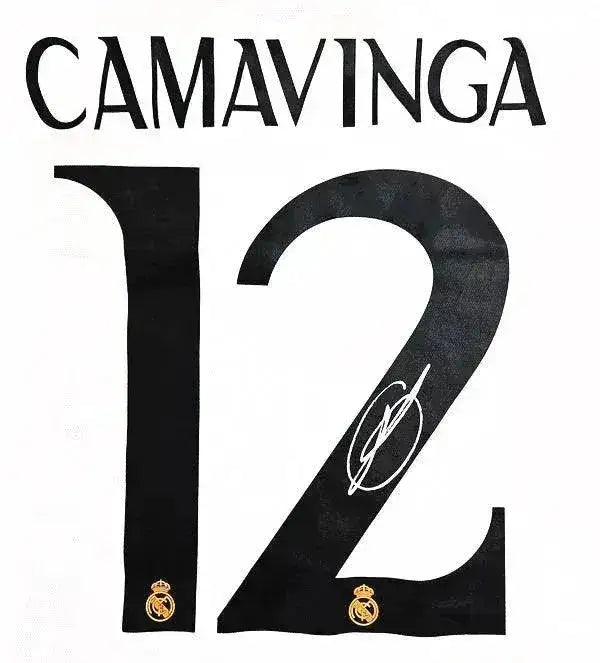 Back view showing No. 12, CAMAVINGA, and a visible signature on a Real Madrid football shirt.