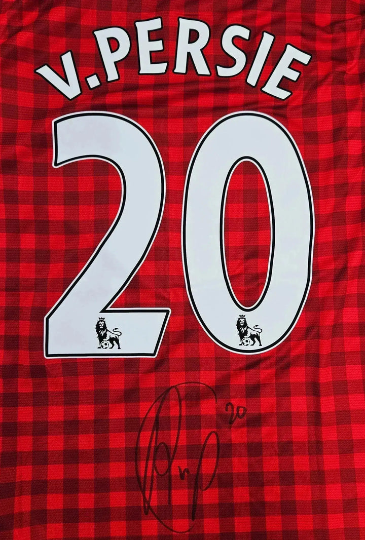 Back view showing V. Persie, No. 20, and a signature on a red checkered Manchester United soccer jersey.