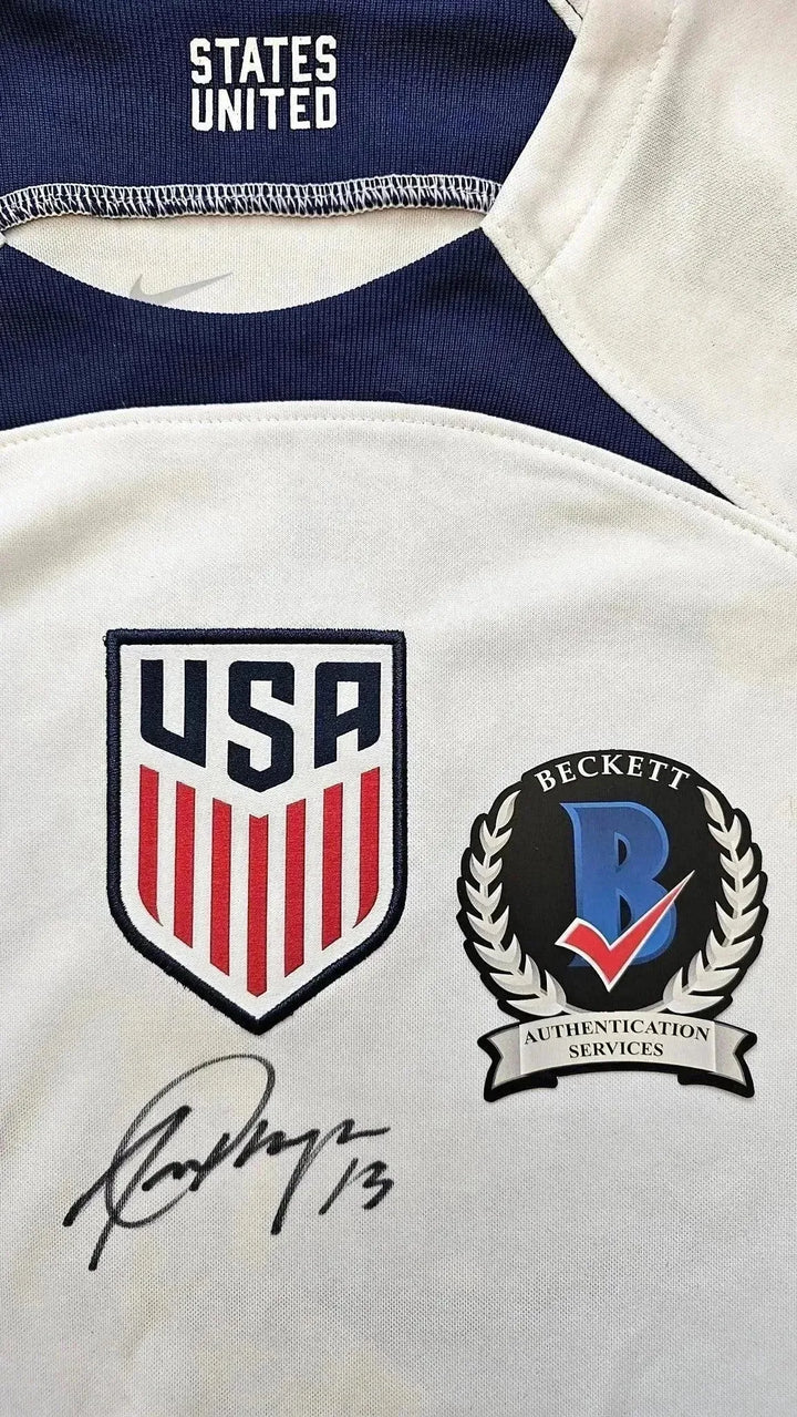 Crest detail showing USA badge, Beckett Authentication seal, and Alex Morgan signature.