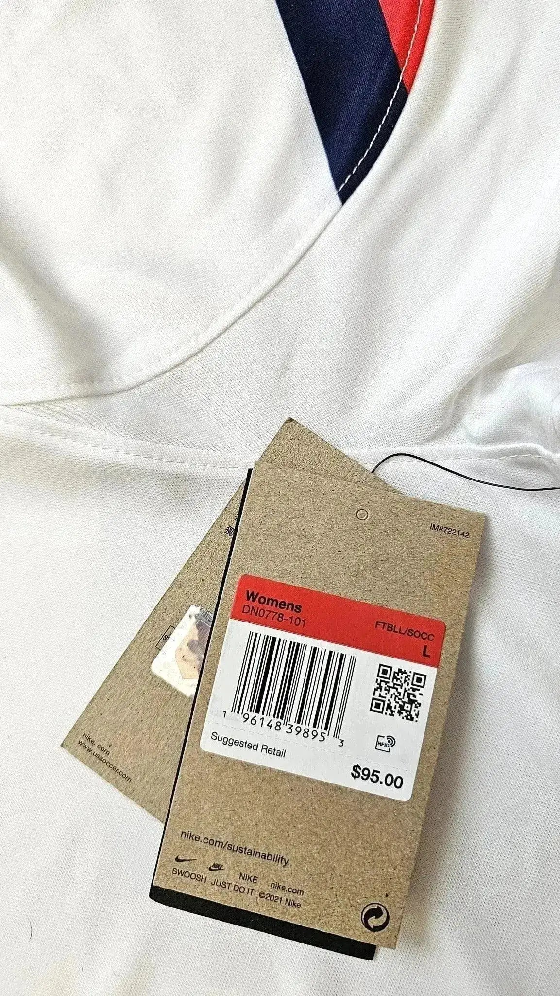 Label showing size L and suggested retail price of $95.00 for women’s soccer jersey.