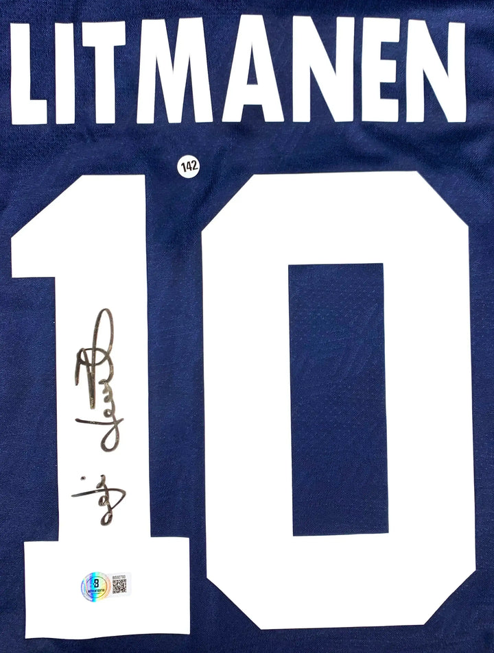 Back view showing Litmanen, No. 10, and signature on a blue football shirt.