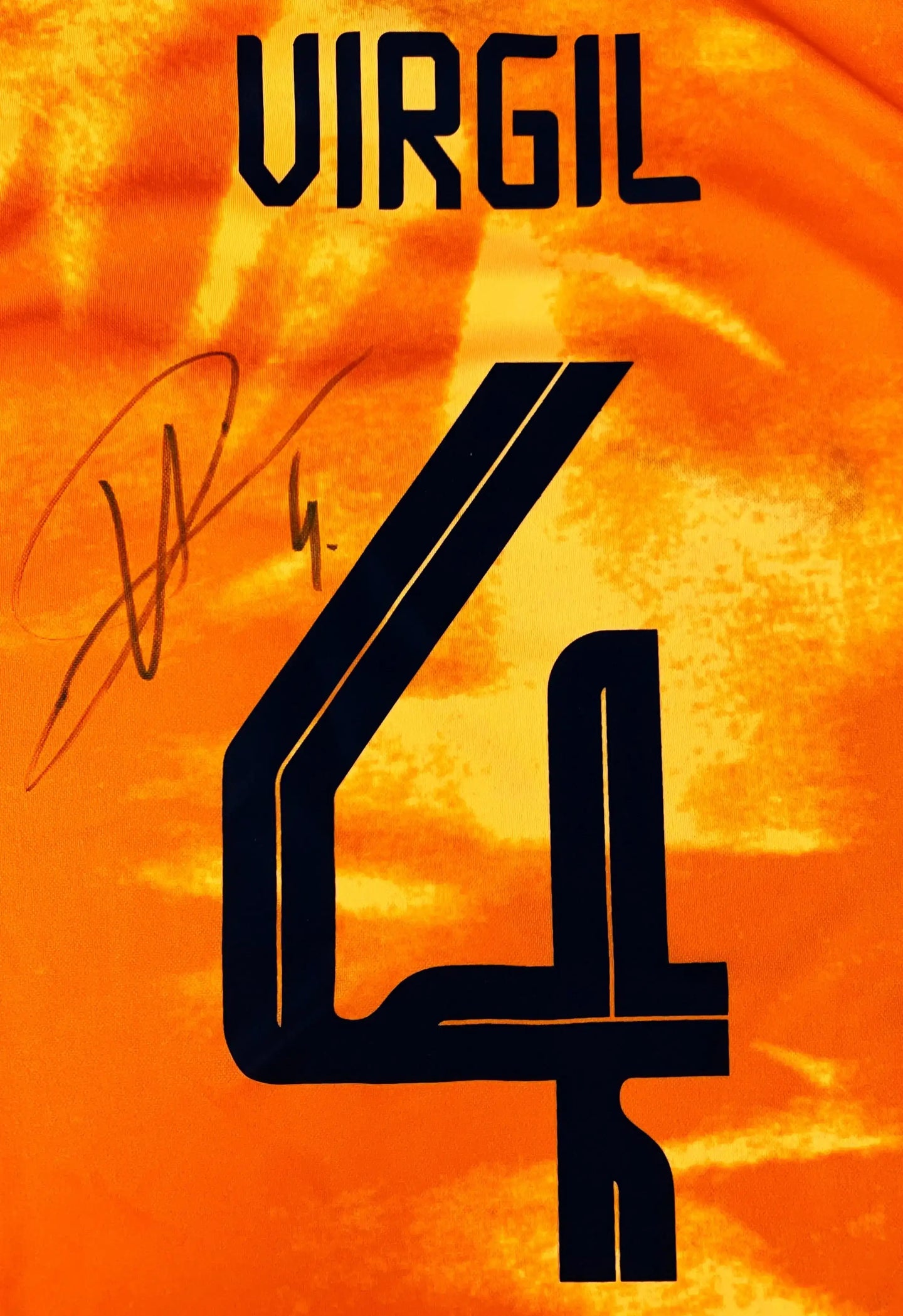 Back view showing name 'VIRGIL', number '4', and signature.