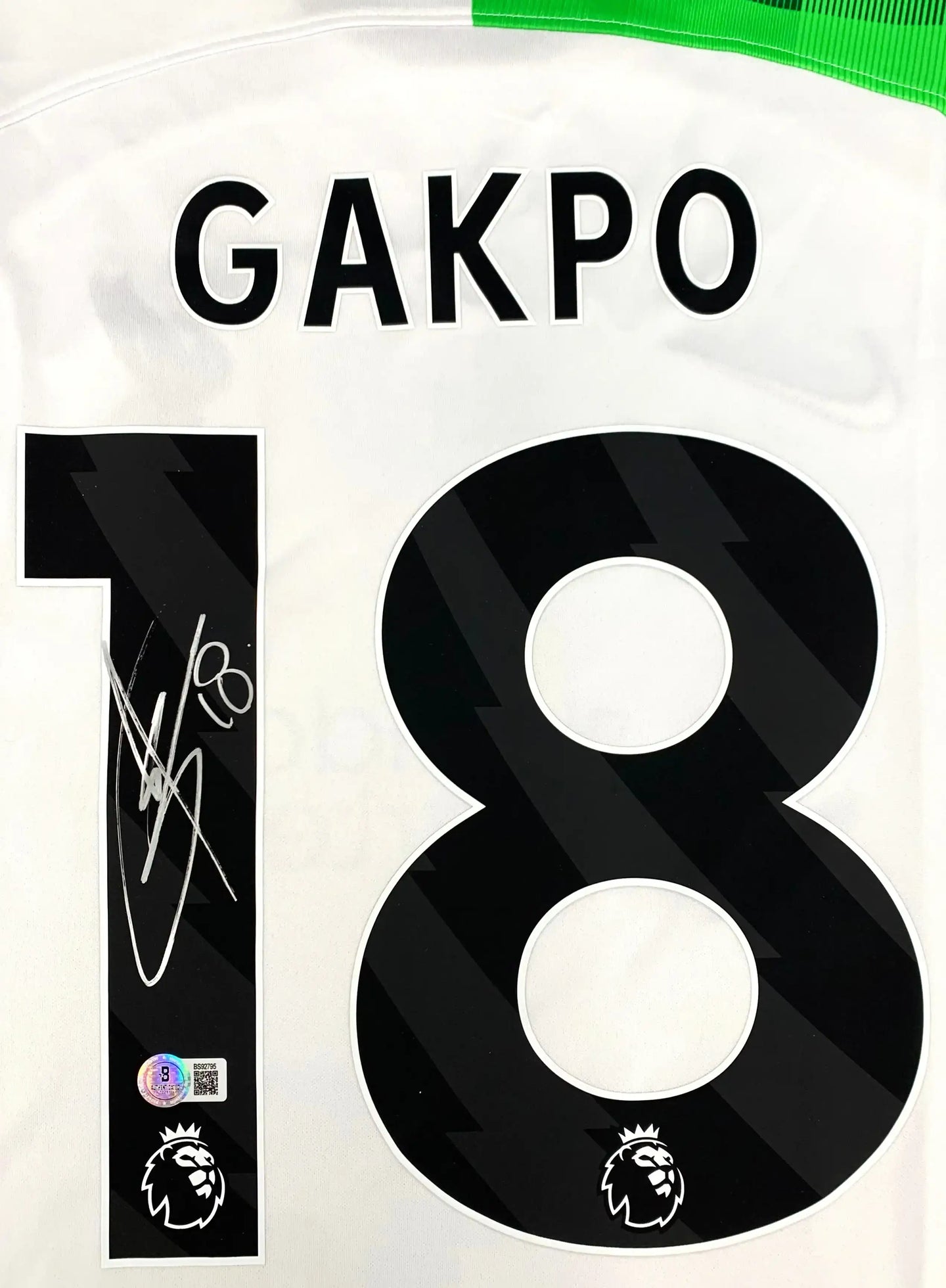 Back view showing GAKPO and No. 18, with a visible signature.