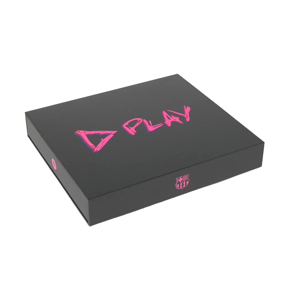 Closed black box featuring pink D PLAY text and FC Barcelona crest detail.