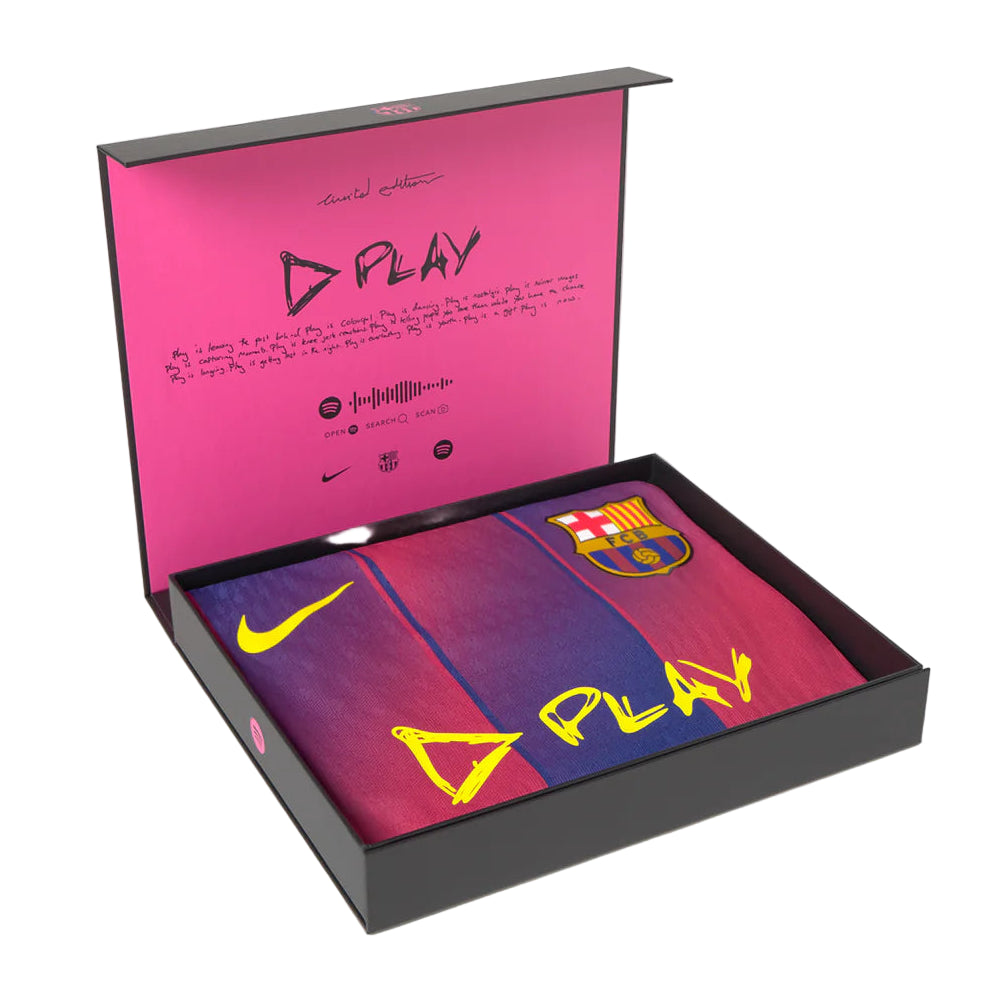 Front view of a Barcelona football shirt in blue and red, inside a limited edition box featuring D PLAY label.