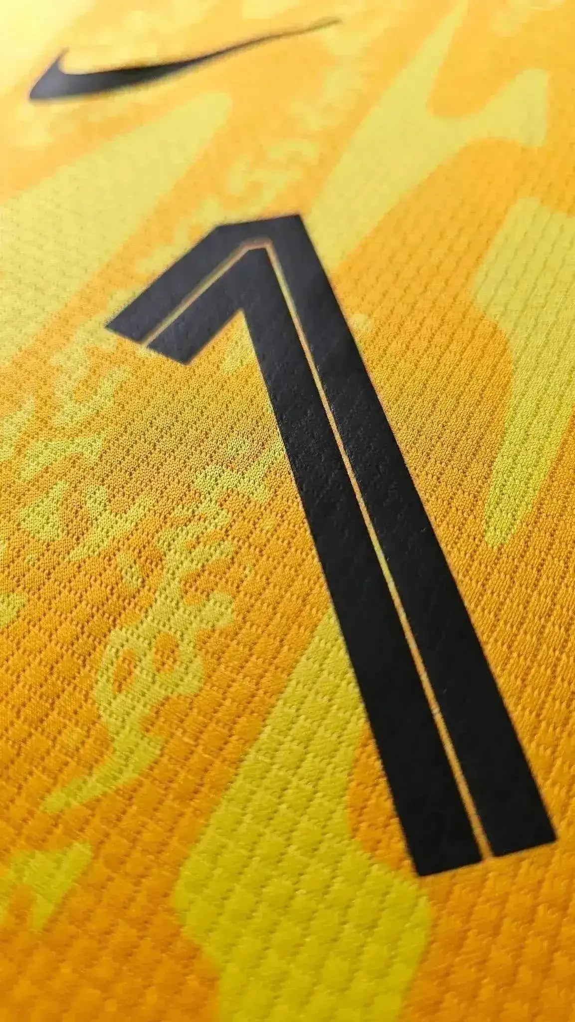 Detail of the No. 1 on Bart Verbruggen's Holland Euro 2024 match-issued shirt in yellow with black accents.
