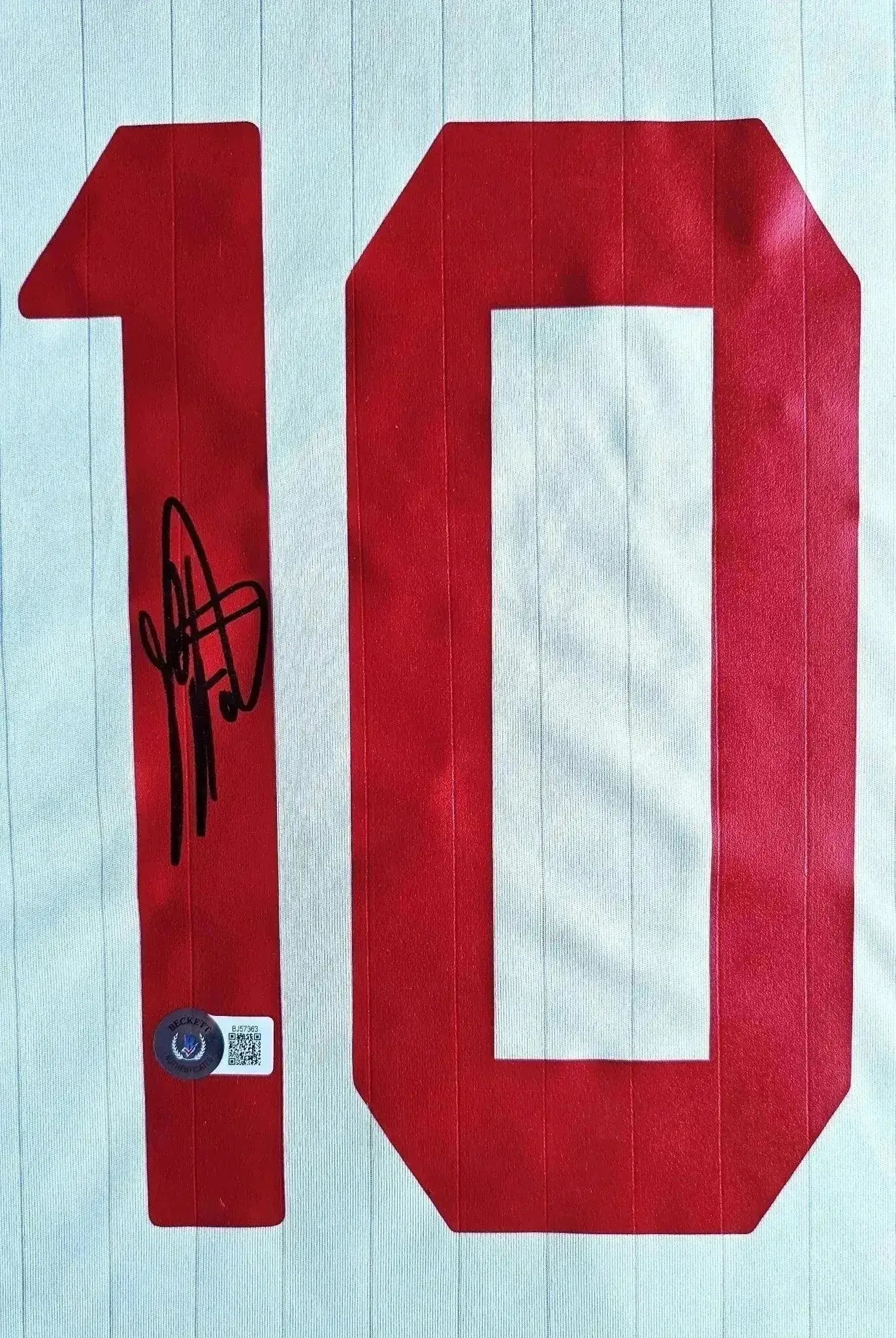 Detail showing No. 10 with signature on AC Milan 2006-2007 soccer jersey.