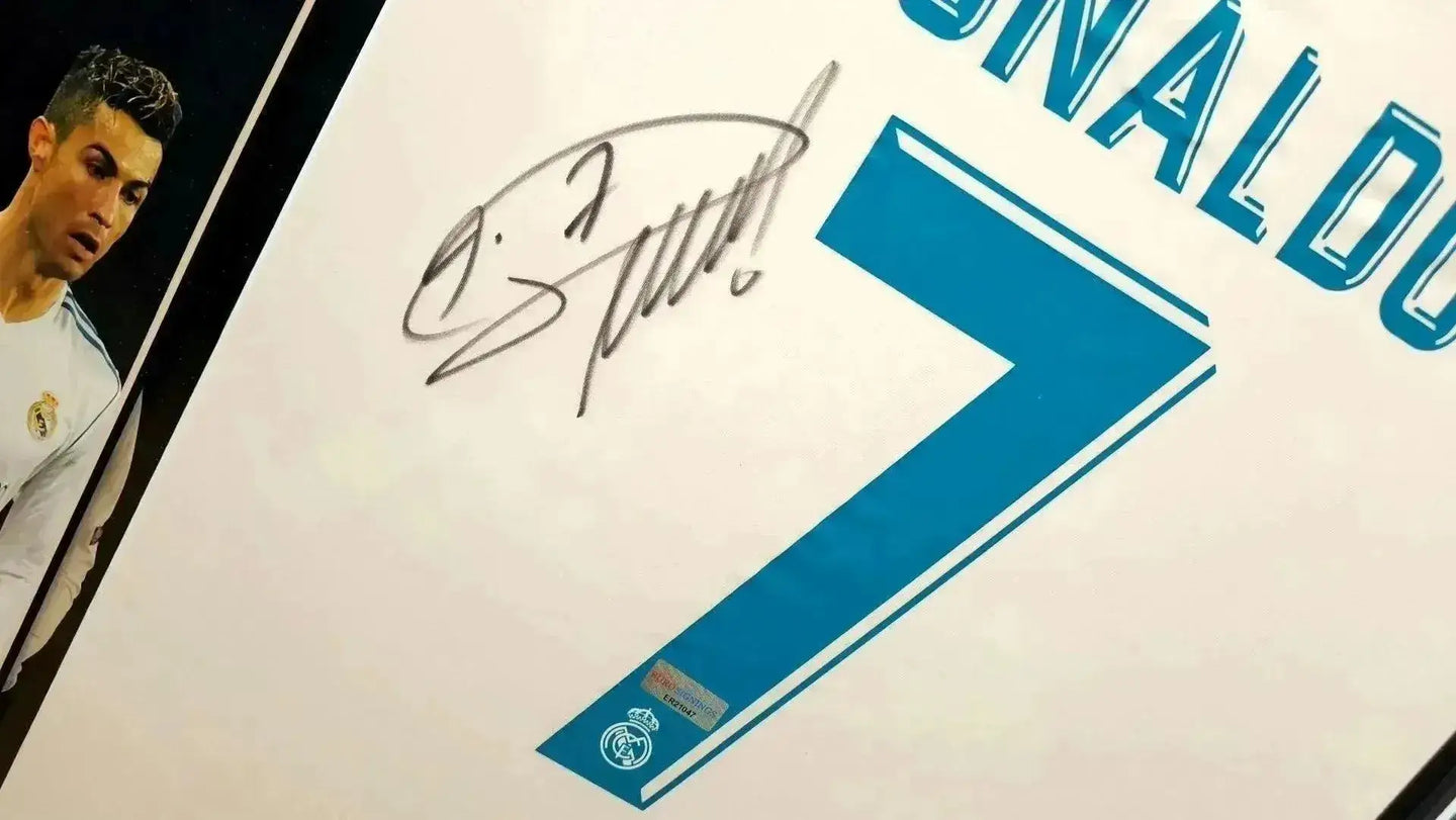 Signature detail featuring Cristiano Ronaldo's autograph and the No. 7 on Real Madrid shirt.