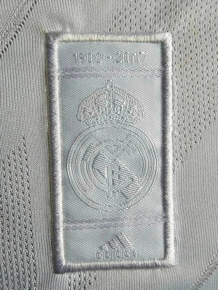 Crest detail featuring Real Madrid emblem with &