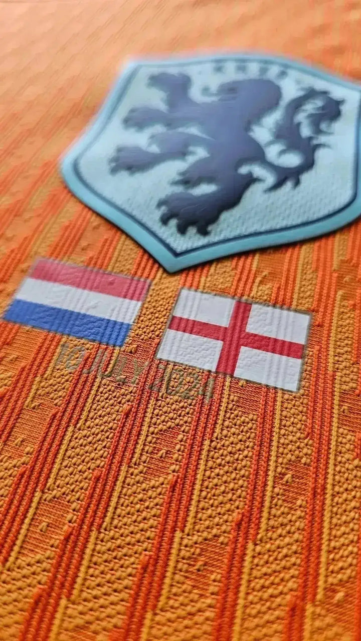 Crest detail featuring the Netherlands lion emblem and flags of the Netherlands and England.