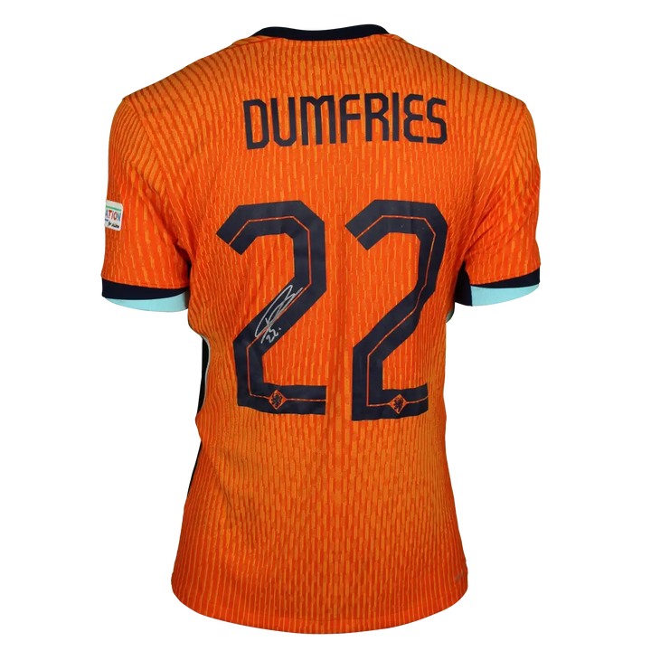 Back view showing Dumfries, No. 22, and a signature in black on an orange football shirt.