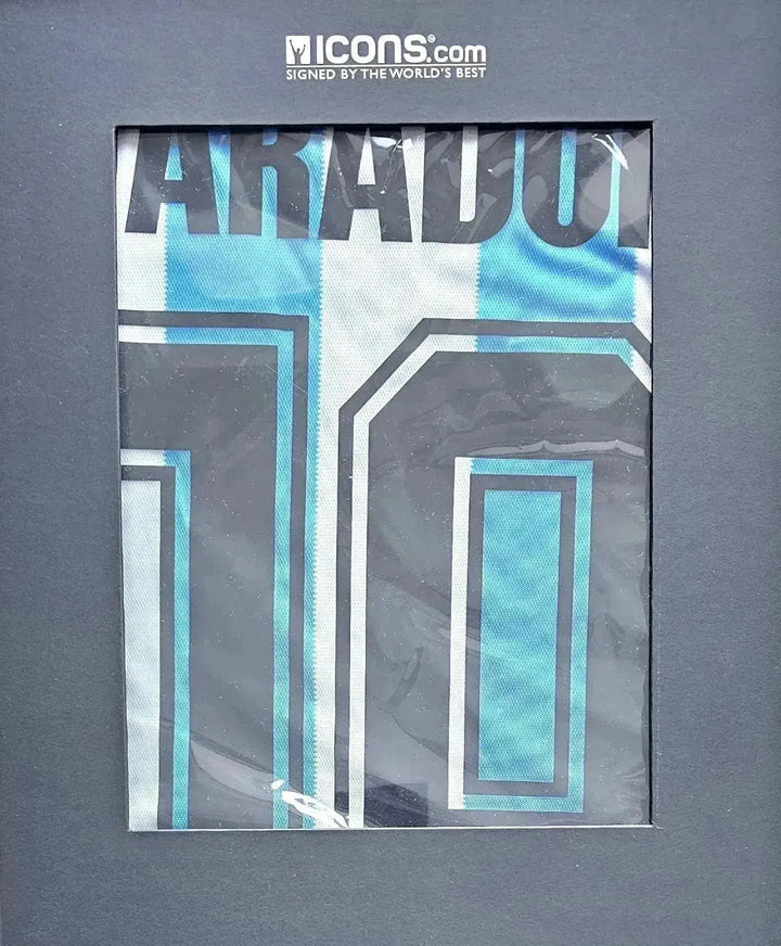 Close-up showing signature detail on Diego Maradona 10 Argentina soccer jersey in blue and white.
