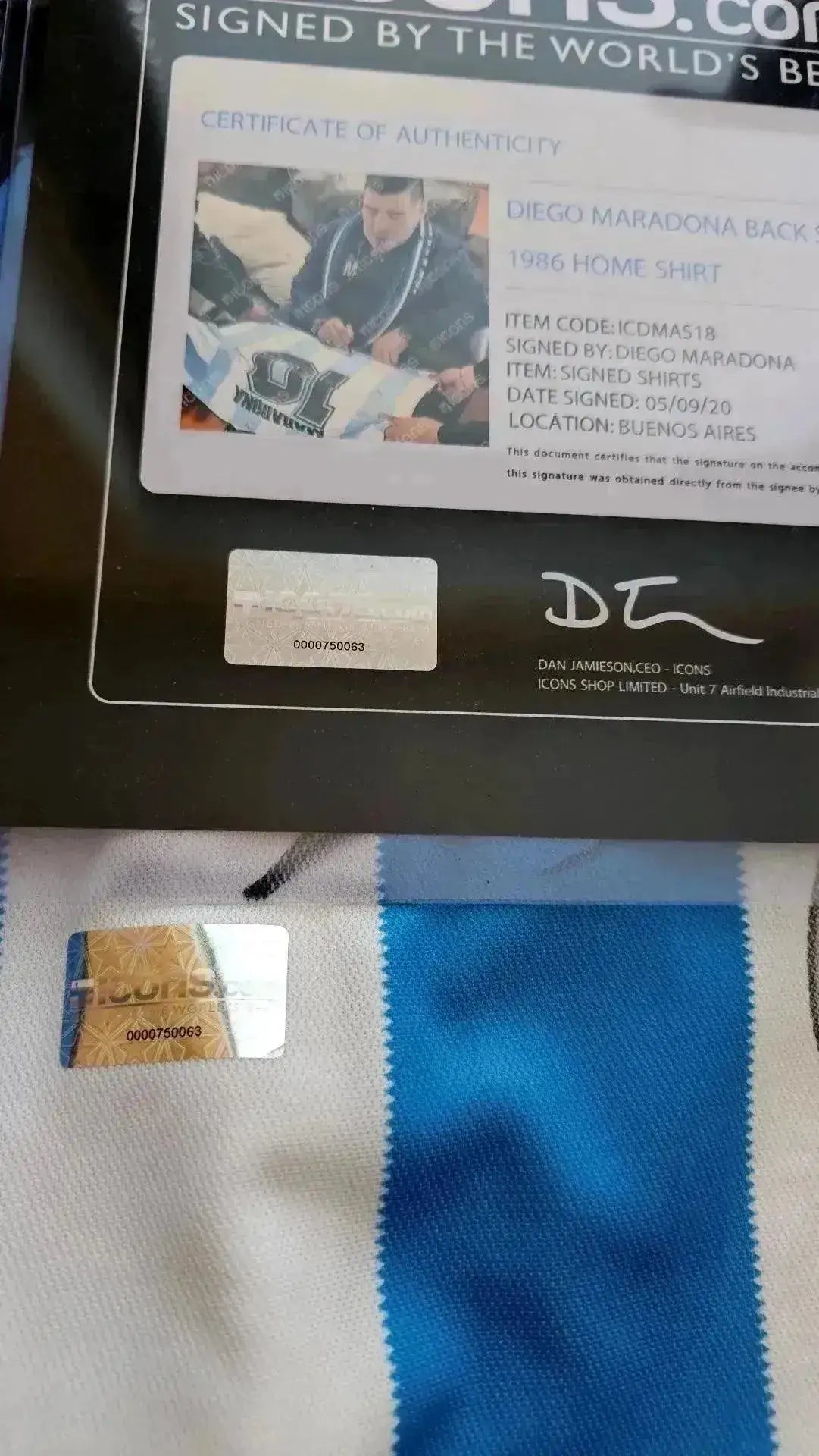Certificate of authenticity details showing Diego Maradona's signature and item information.