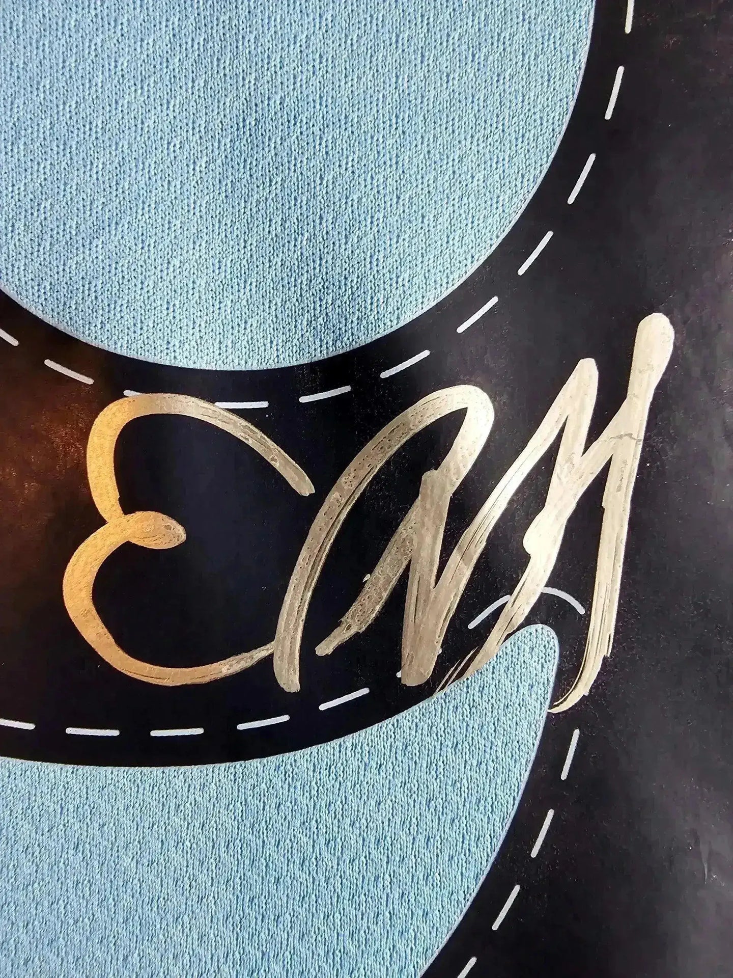 Close-up of signature detail on Erling Haaland's signed Manchester City soccer jersey.