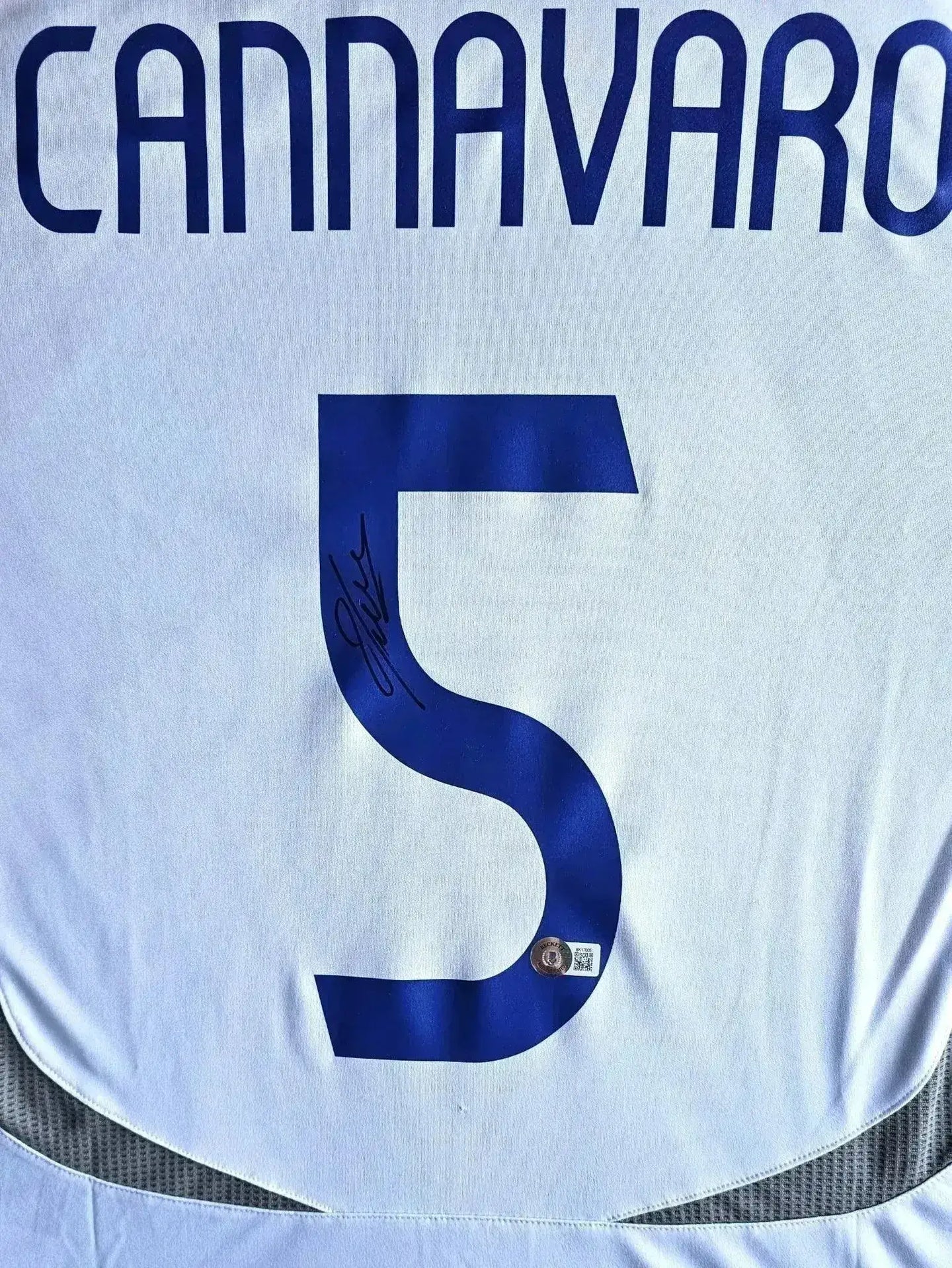 Back view featuring Cannavaro, No. 5, and a visible signature.