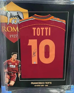 Back view showing signature, player name Totti, and squad number 10 with AS Roma crest.