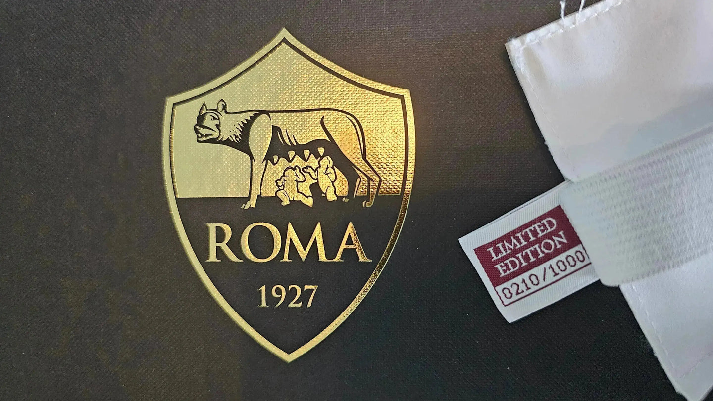A.S. Roma crest featuring a wolf and three figures, with 'LIMITED EDITION 0210/1000' tag.