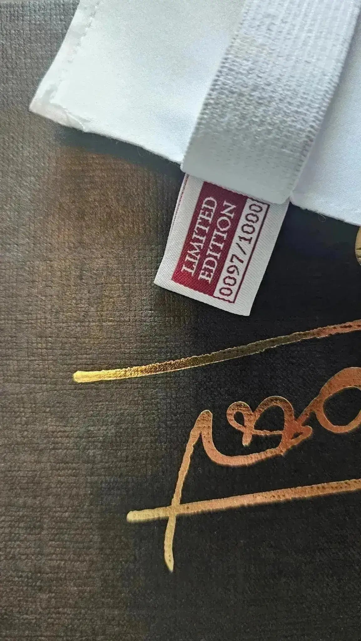 Limited Edition tag showing No. 0097/1000 with a signature detail.