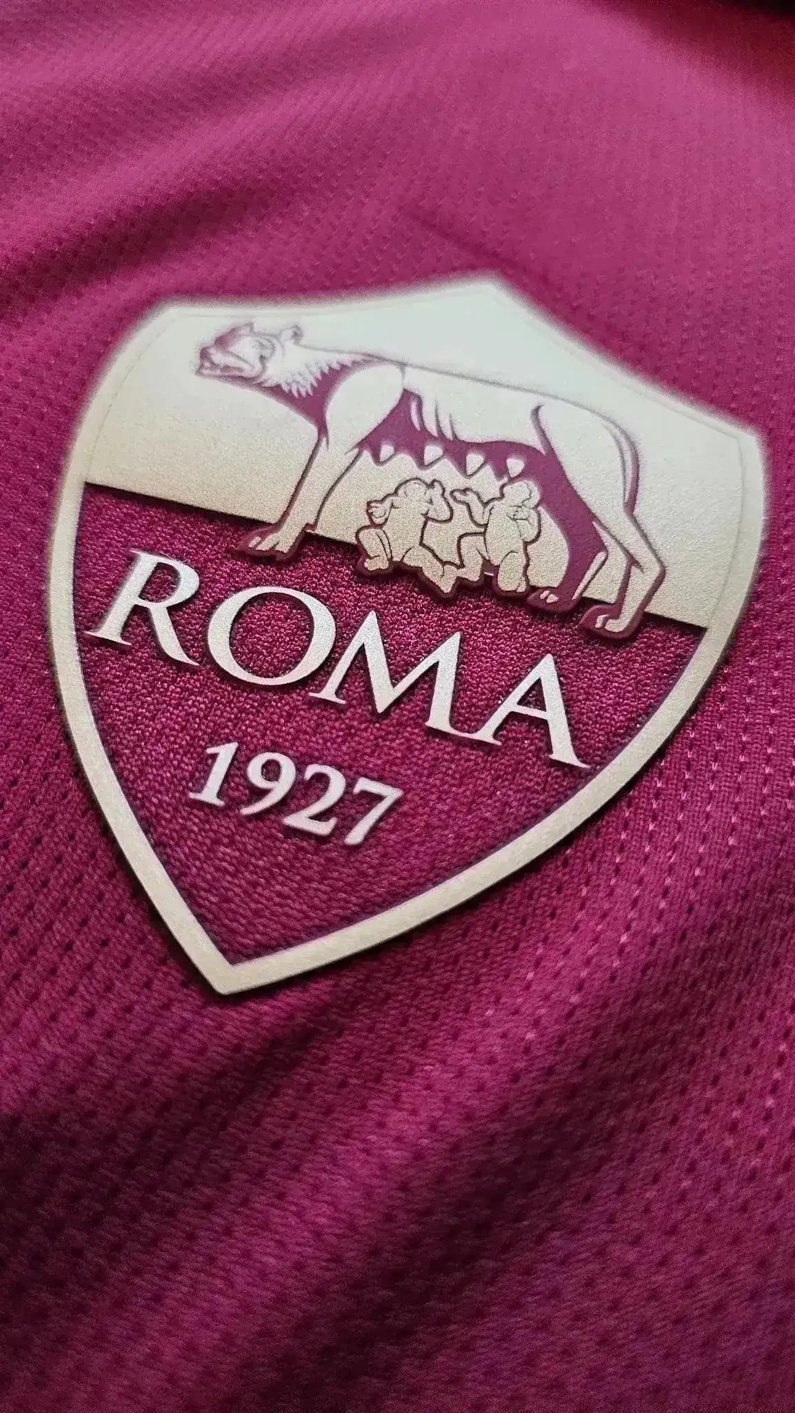Crest detail showing A.S. Roma logo with 'ROMA' and '1927' on a red background.