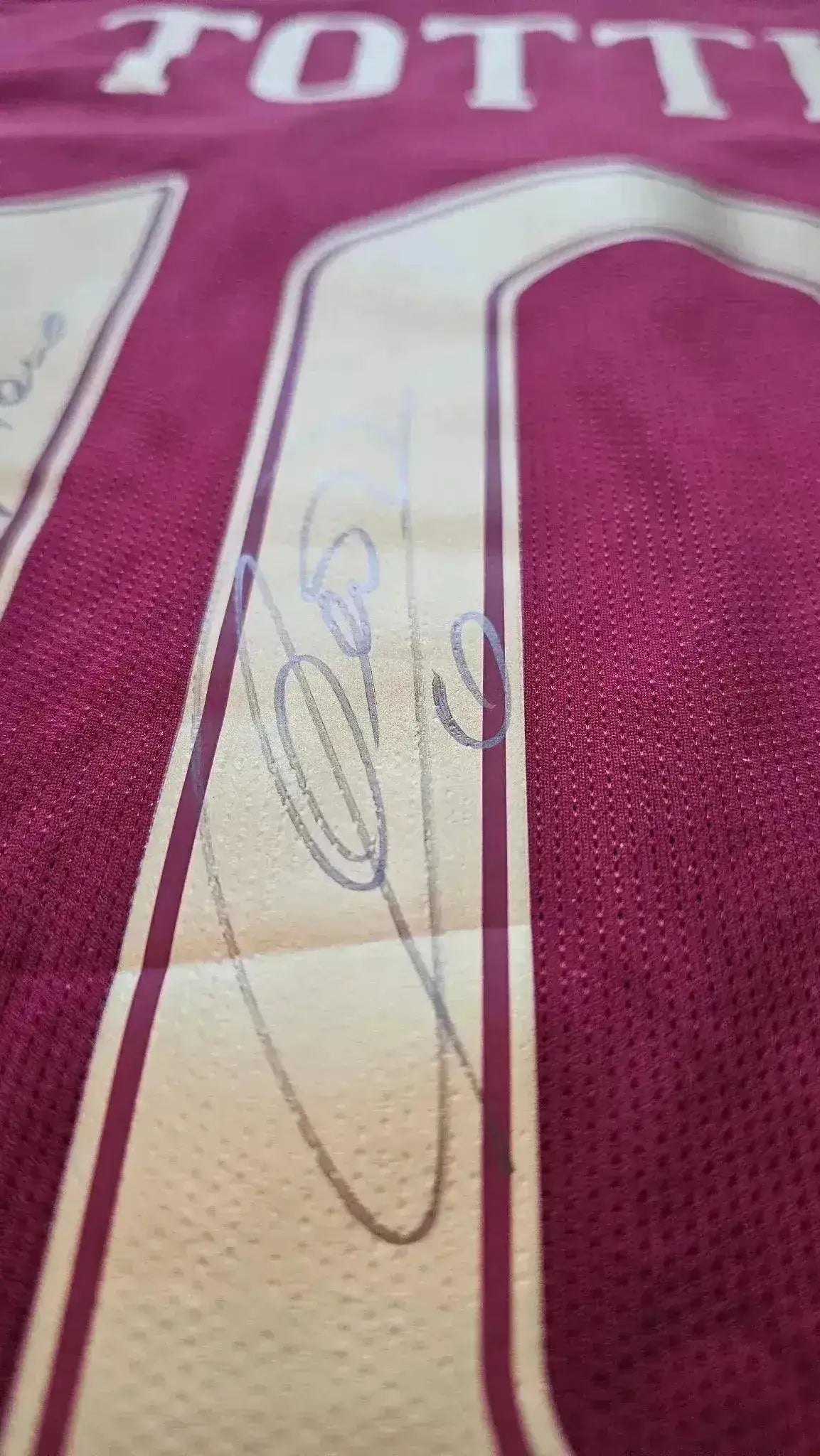 Close-up of signature detail on Francesco Totti's No. 10 Rome football shirt.