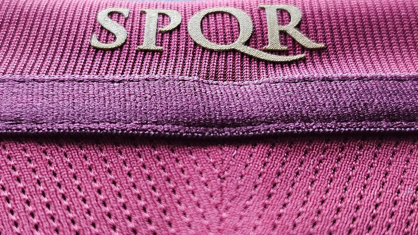 Close-up of SPQR logo on the collar of a signed Francesco Totti Roma football shirt.
