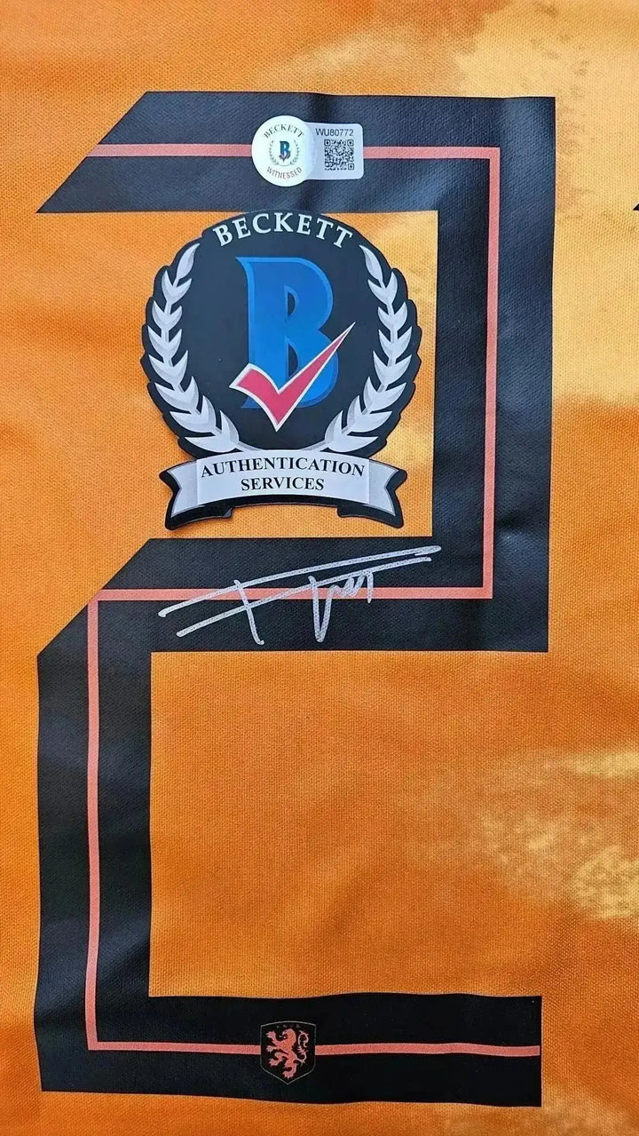 Detail view showing signature and Beckett authentication stamp on number 21.