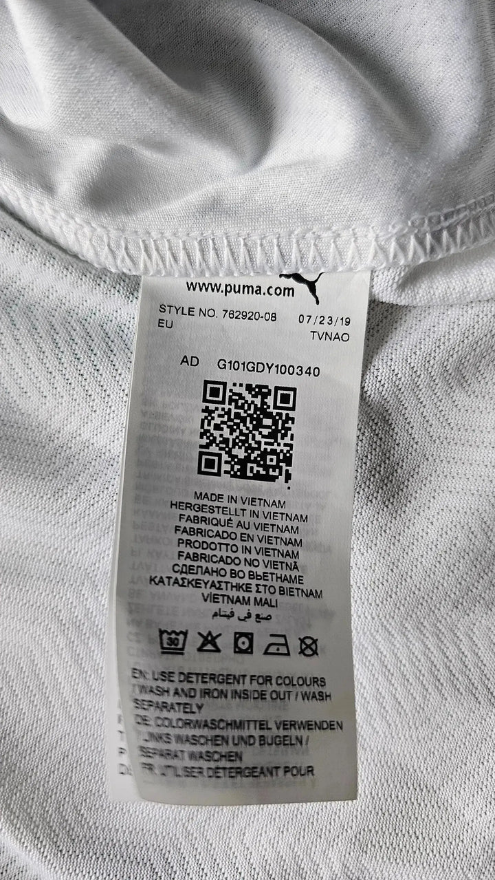 Care label showing style number 782920-08 and care instructions for the football shirt.