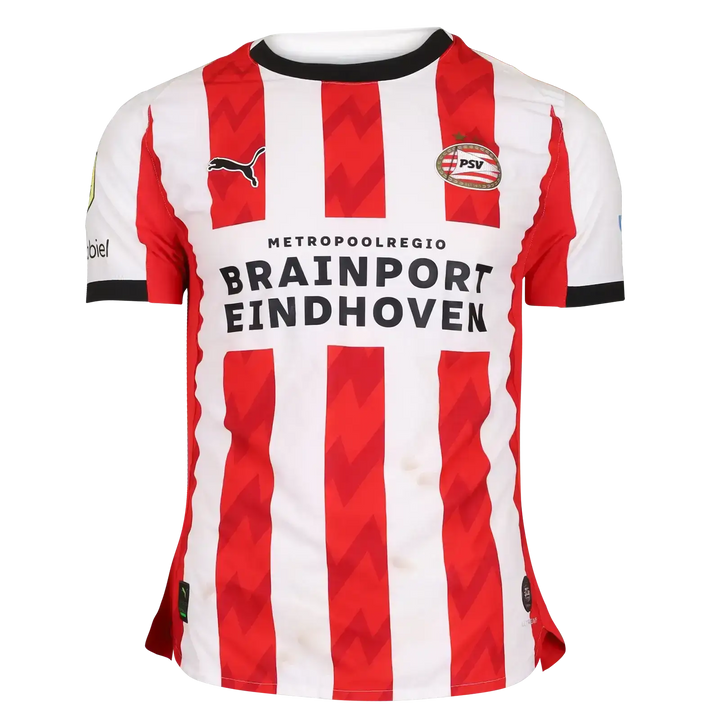 Front view of red and white striped PSV Eindhoven shirt with 'BRAINPORT EINDHOVEN' text and Puma logo.