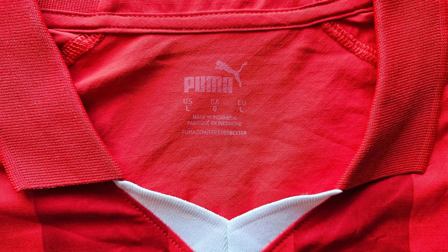 Back view showing label with PUMA logo, size L, and care instructions in red and white.