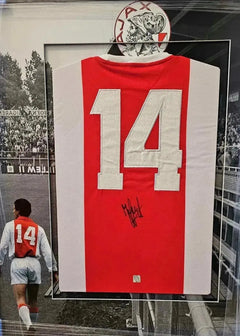 Back view showing No. 14 and signature of Johan Cruyff on Ajax home soccer jersey.