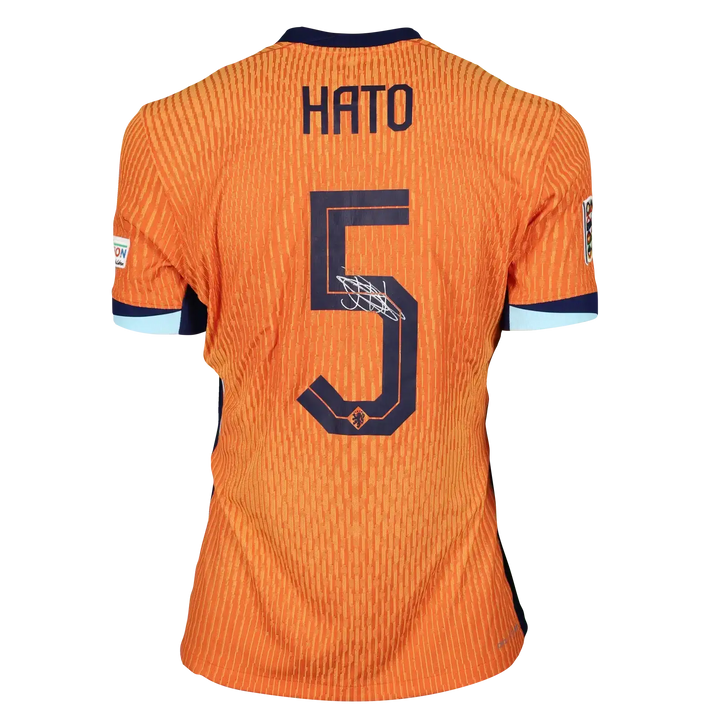 Back view showing player name HATO, number 5, and signature in orange football shirt.