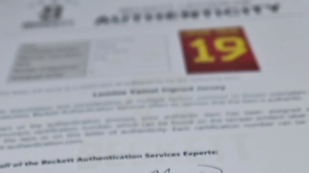 Blurred Beckett Letter of Authentication document with text and a red image featuring the number 19.